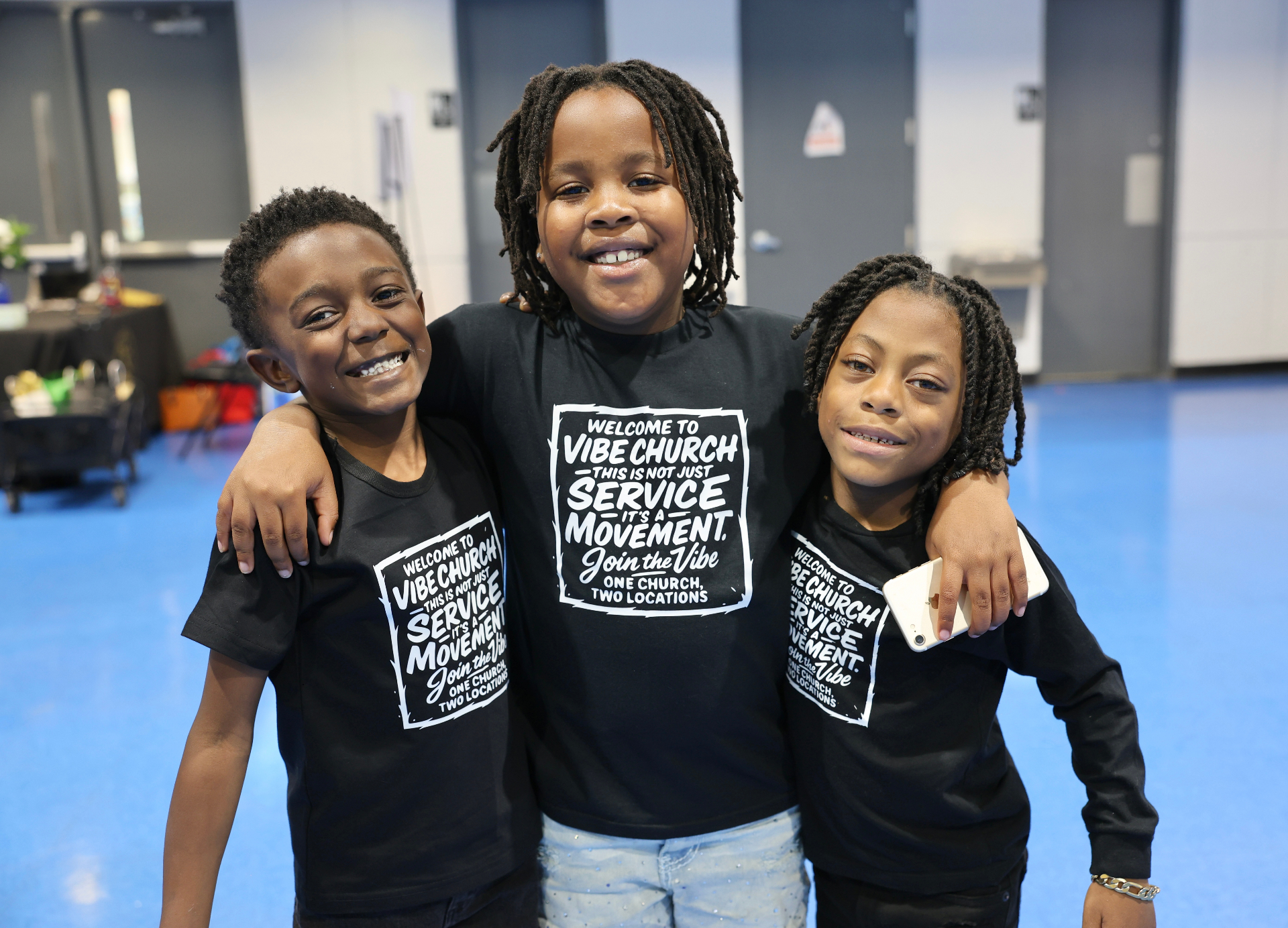 Three Vibe Church youth smiling together
