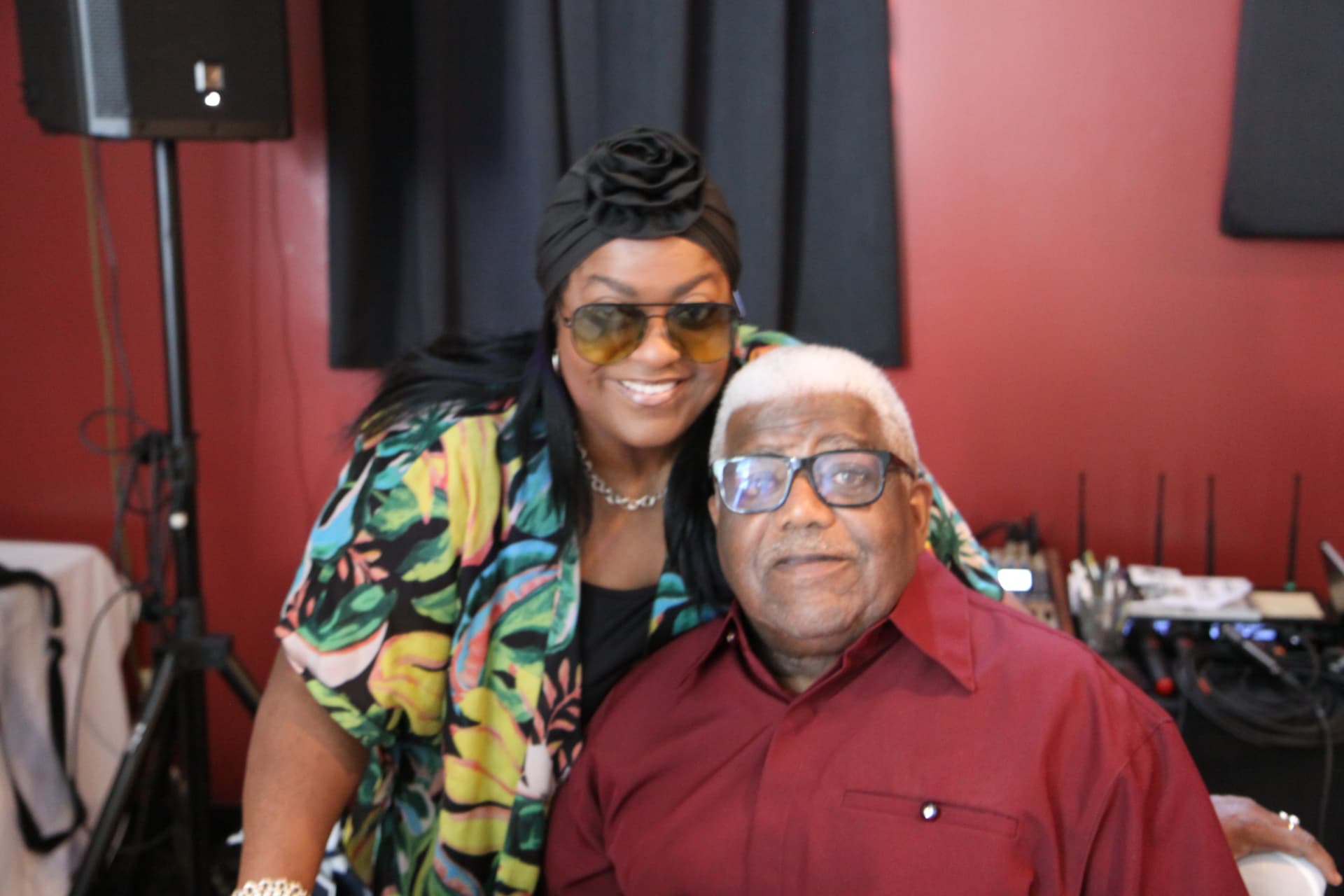 Two guests smiling together at the celebration