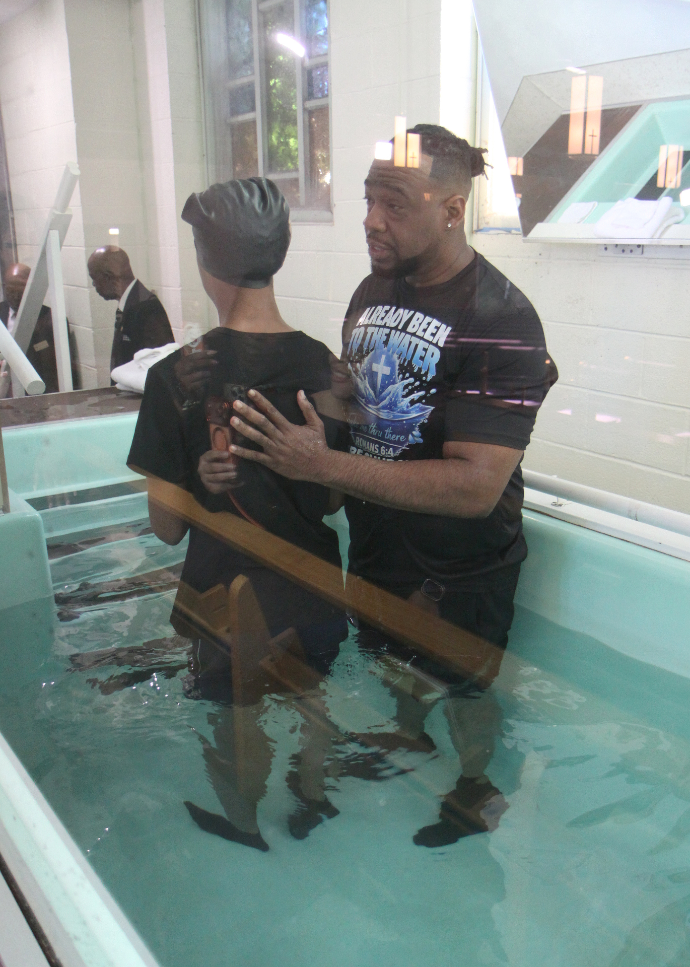 Pastor Henderson preparing to baptize a believer