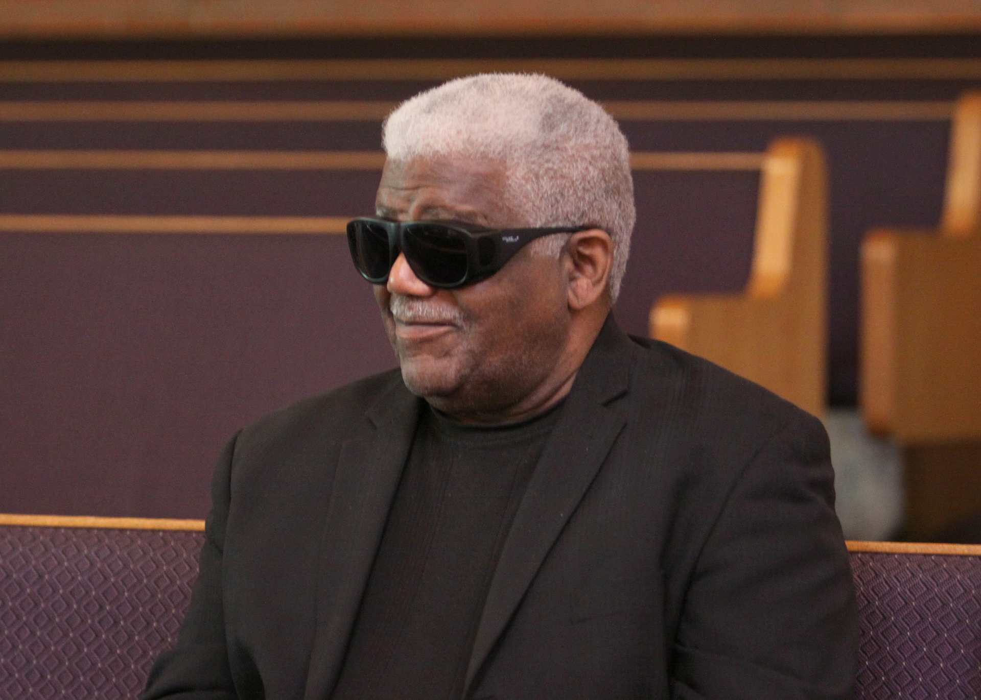 Church elder seated in the sanctuary