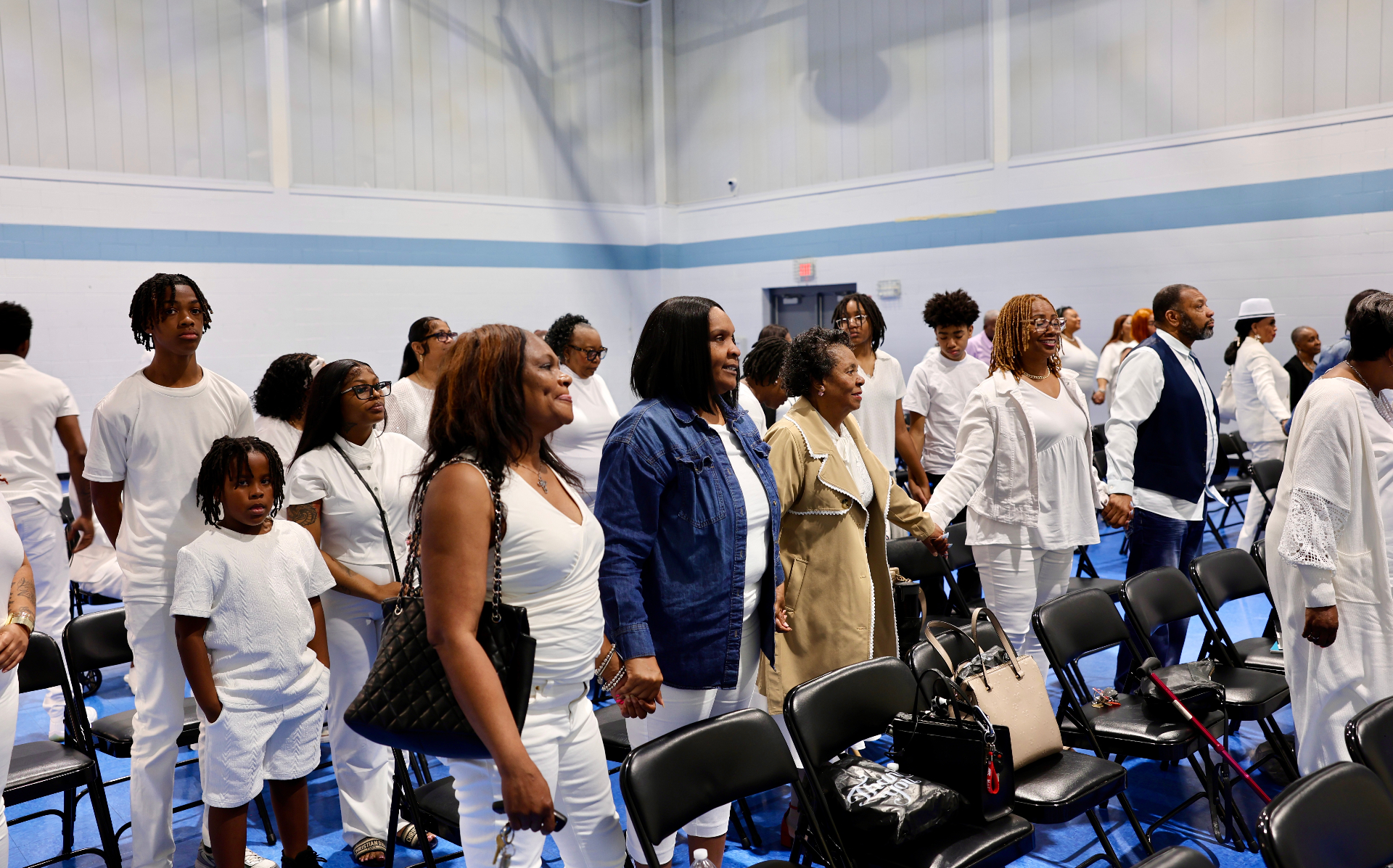 Congregation standing together in worship