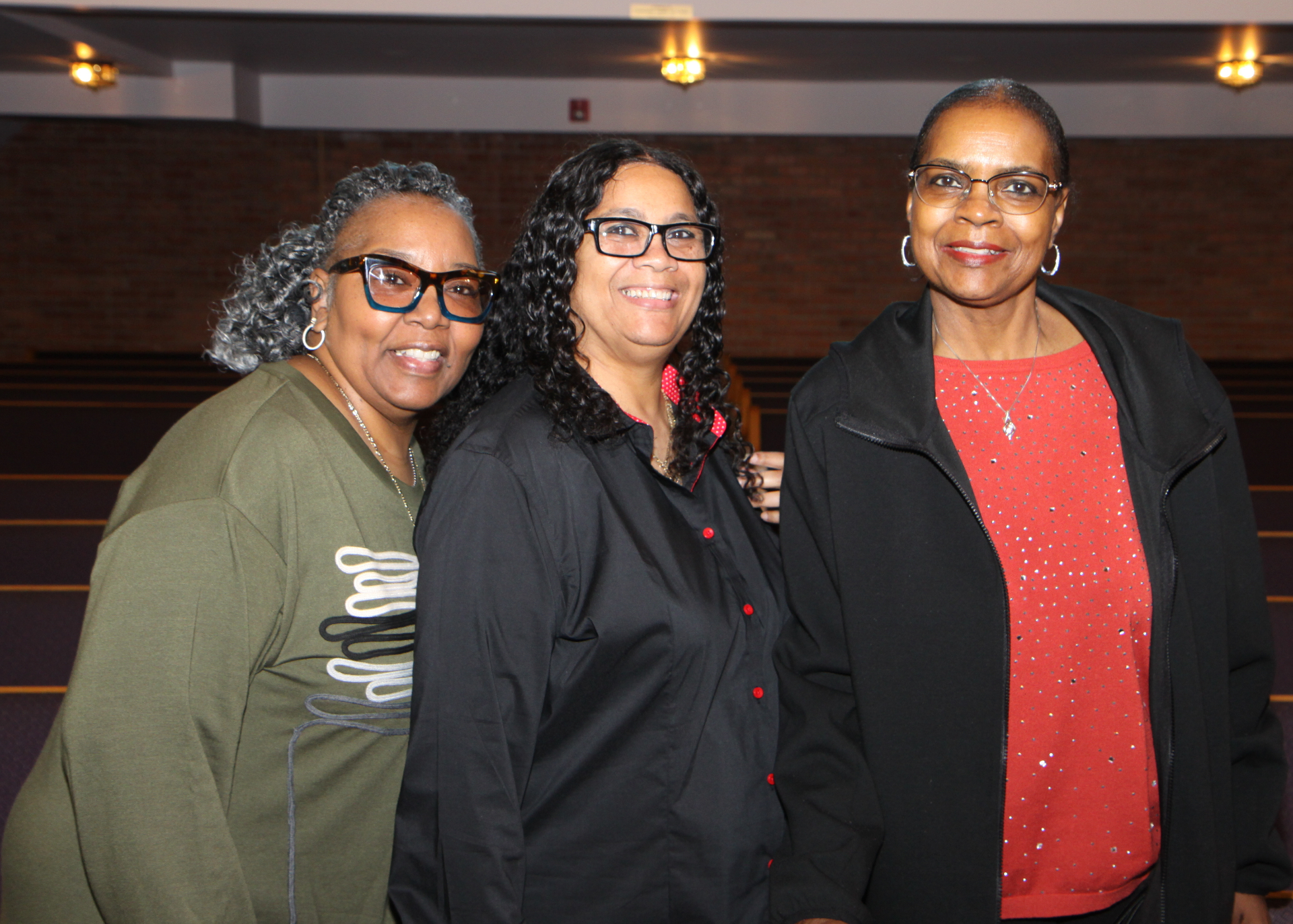 Three Vibe Church sisters smiling together