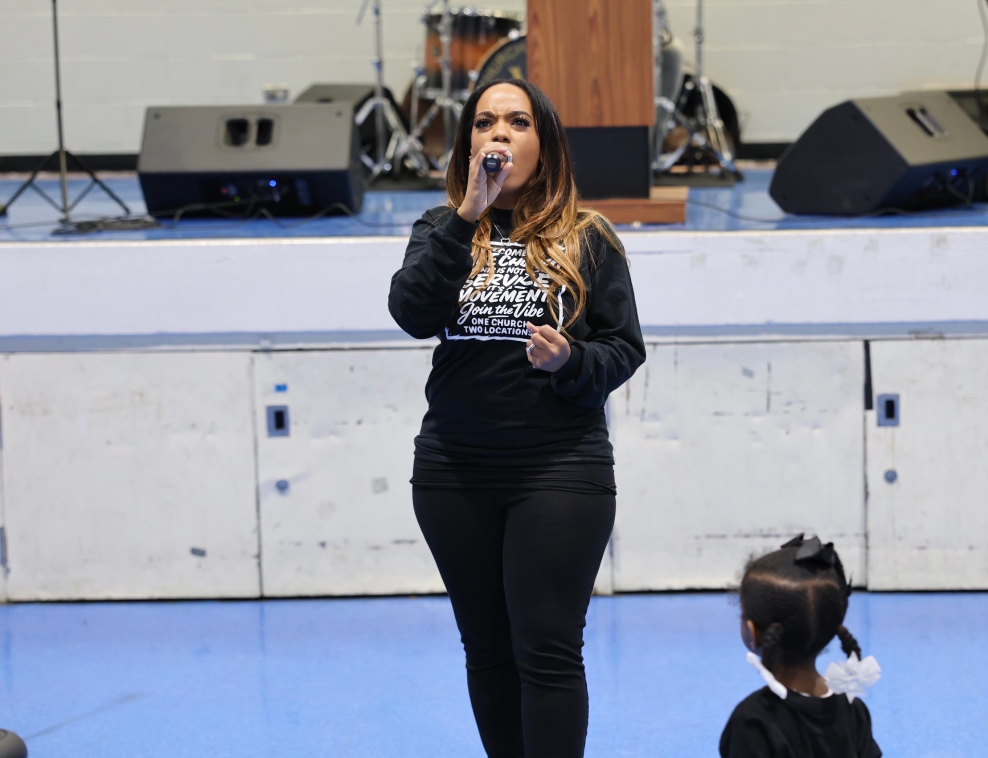 Worship leader singing into a microphone