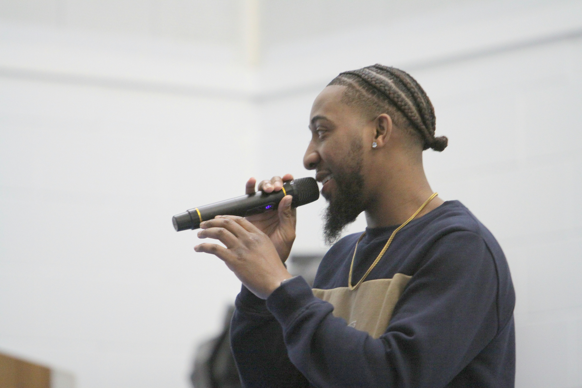 Young worship leader singing into a microphone