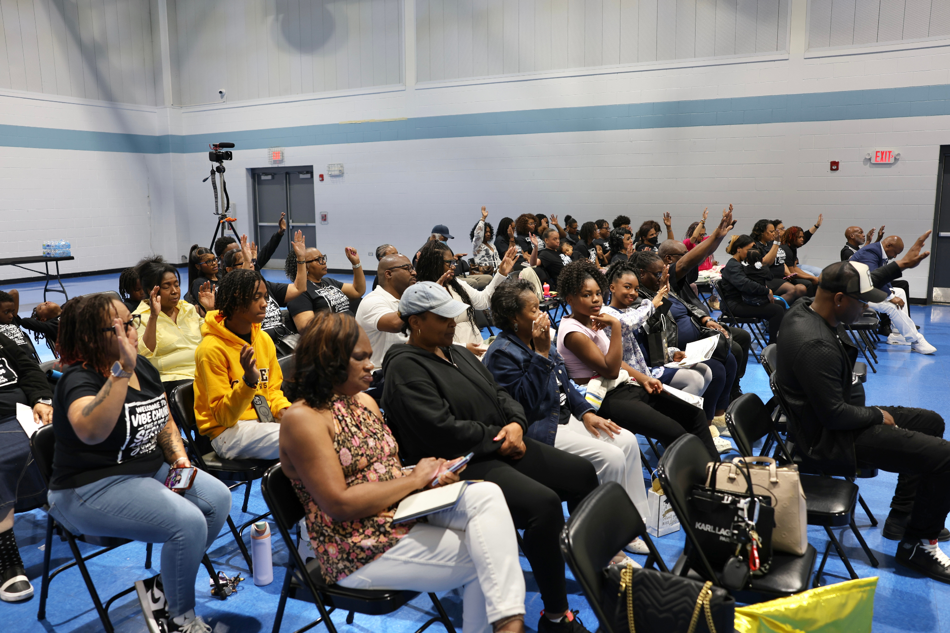 Congregation worshipping with hands lifted