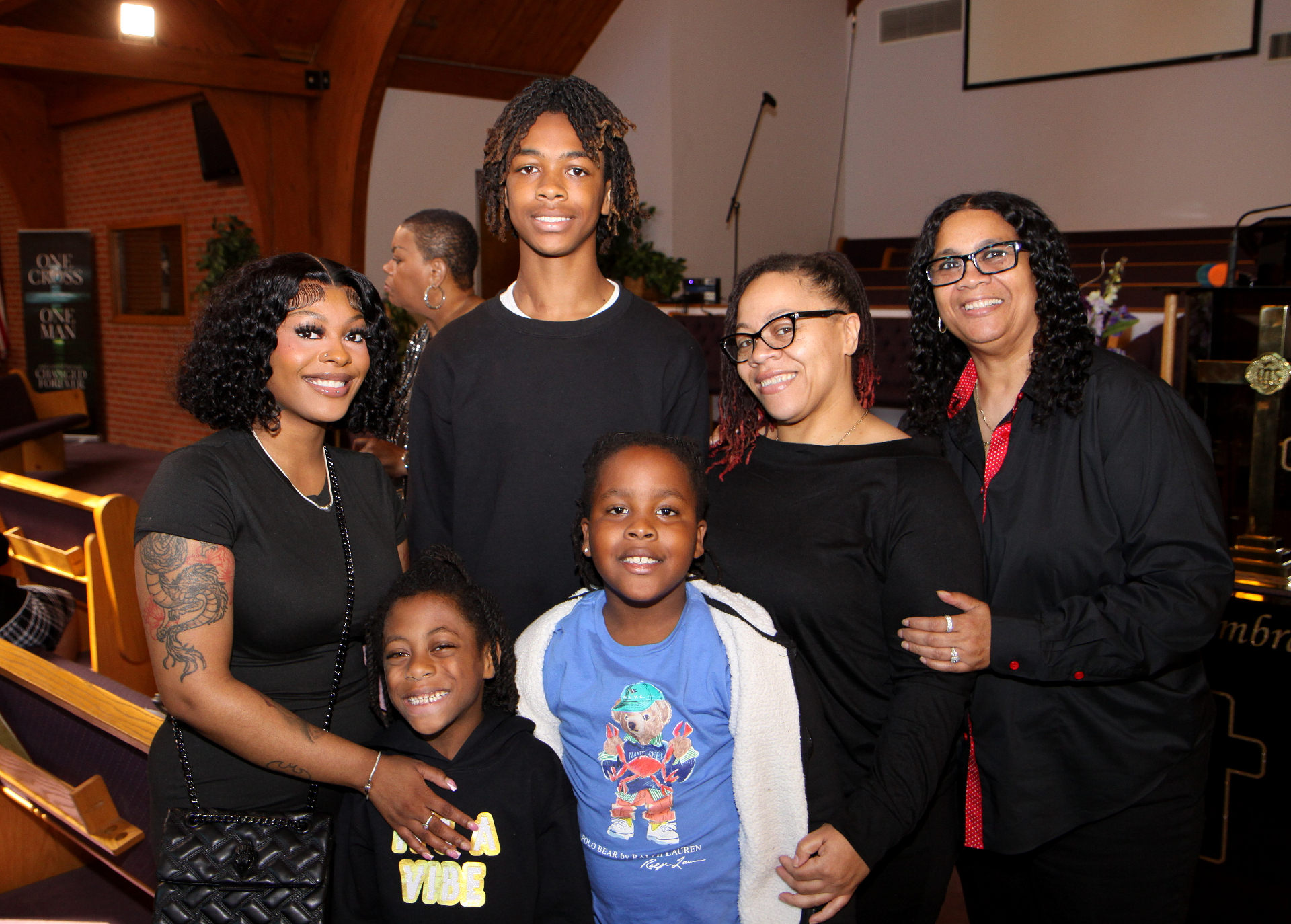 Tanesha Reid with her family gathered in the sanctuary