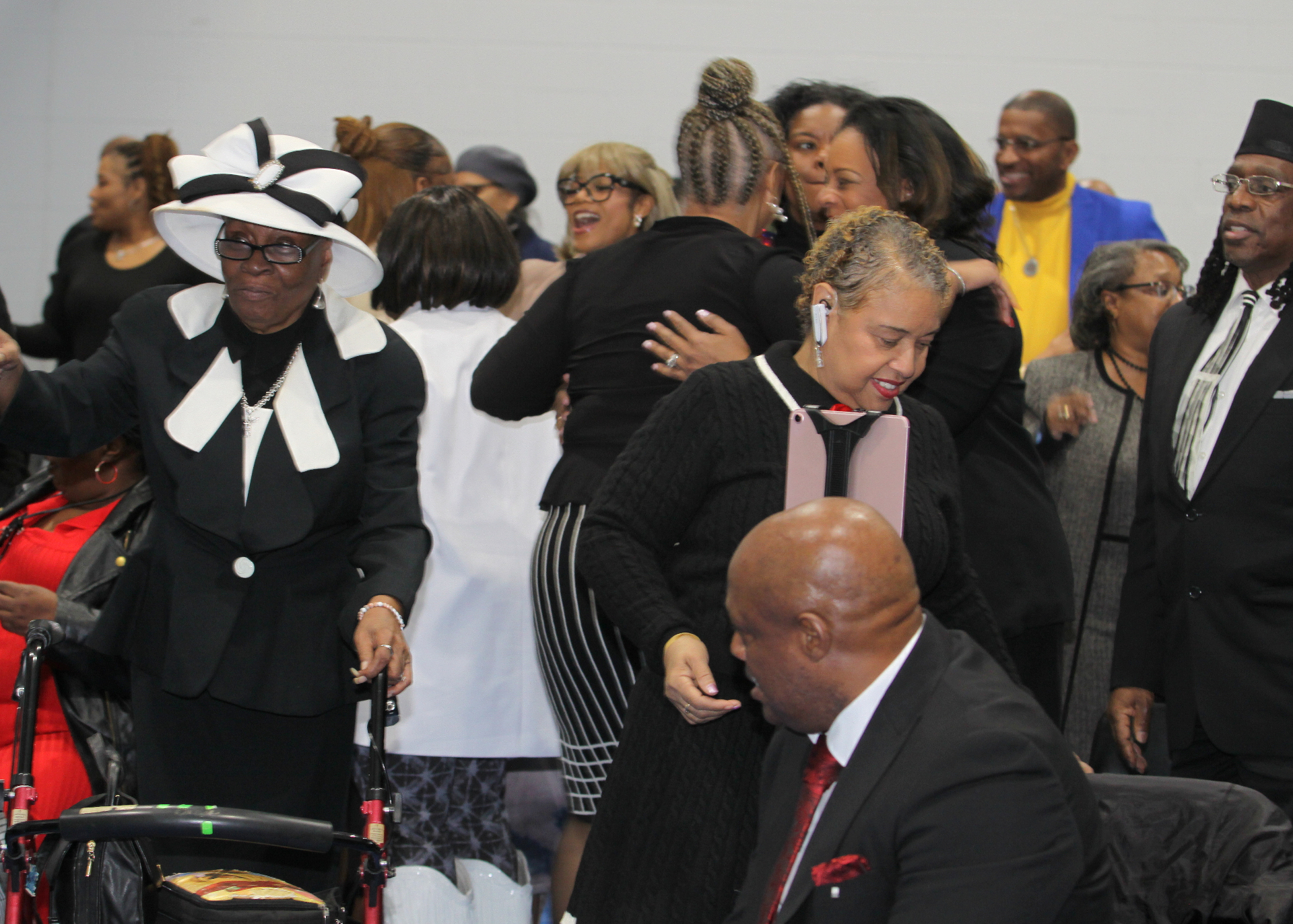 Vibe Church members greeting and hugging one another